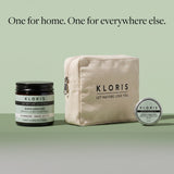 Kloris Rapid Comfort Botanical Recovery Balm shown with branded packaging on a pale green background: a black jar, a beige canvas zip pouch, and a round silver tin.